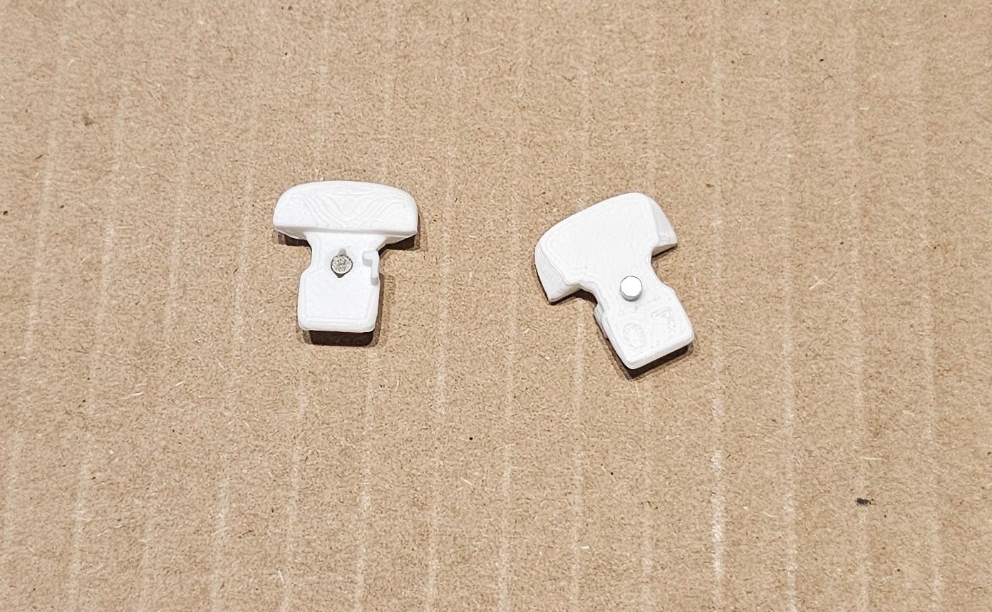 Putting a magnet in each key. I used an extra magnet to hold everything in place as the glue dried. 